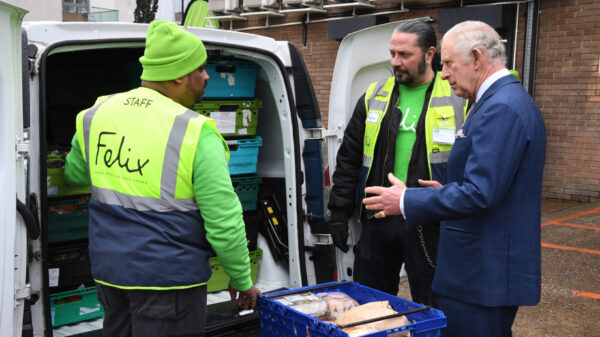 King Charles with Felix project staff filling up a van with food