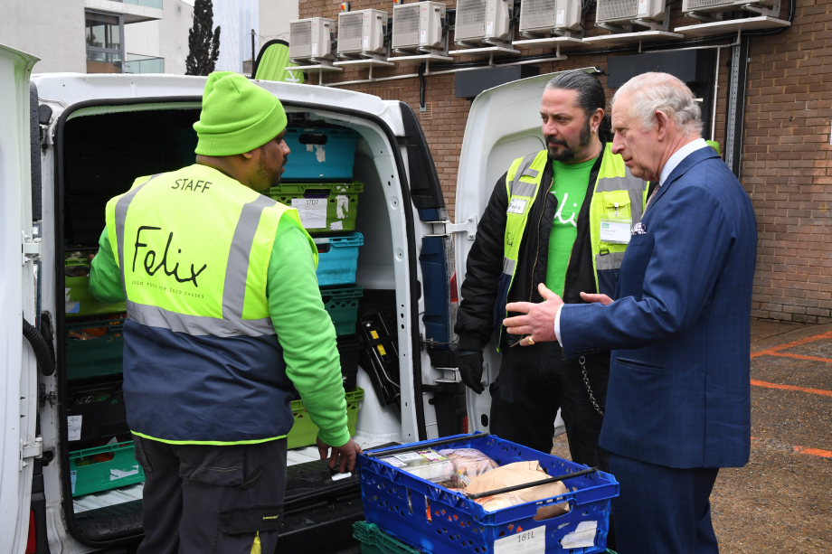 King Charles with Felix project staff filling up a van with food