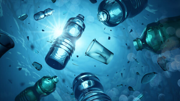 Problem plastic bottles and microplastics floating in the open ocean. Marine plastic pollution concept. 3D illustration UK Research and Innovation (UKRI) has launched £6 million in funding to support five plastic projects that will support a sustainable system.