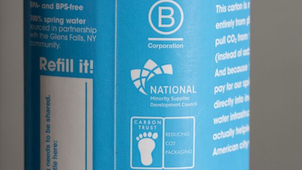 Certified B Corporation, National Minority supplier Development Council, and Carbon Trust labels are seen on a carton of Just Water. carbon neutral label