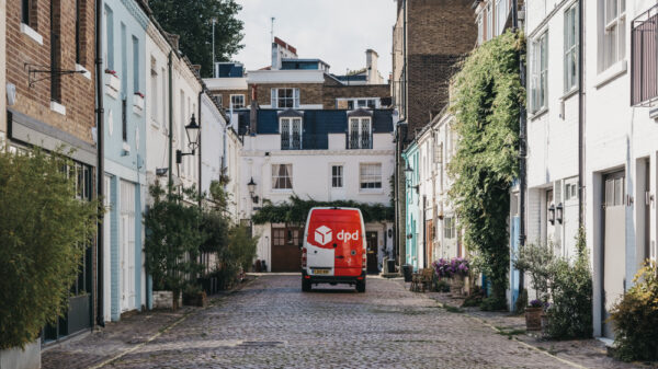 DPD Delivery van driving past mews houses in Paddington, London, UK. DPDgroup is an international parcel delivery service with an extensive network in UK.