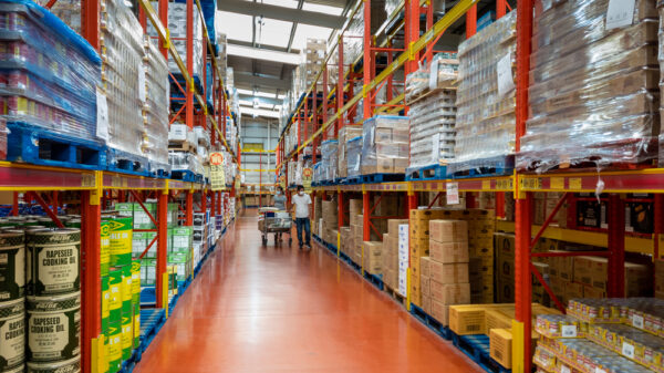 the wholesale section of Wing Yip supermarket with industrial shelving and pallets of packaged goods and foods for catering trade customers. The UK government has now updated the EPR regulations to ensure that business-only packaging will not be classified as household packaging.