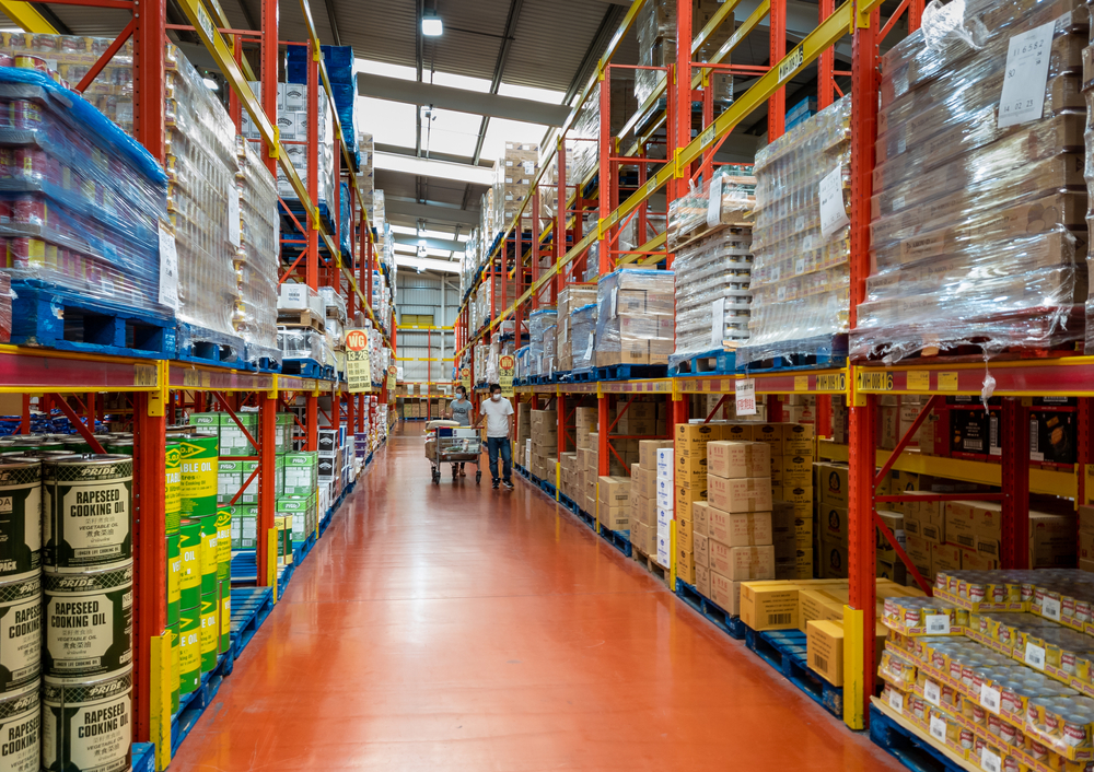 the wholesale section of Wing Yip supermarket with industrial shelving and pallets of packaged goods and foods for catering trade customers. The UK government has now updated the EPR regulations to ensure that business-only packaging will not be classified as household packaging.